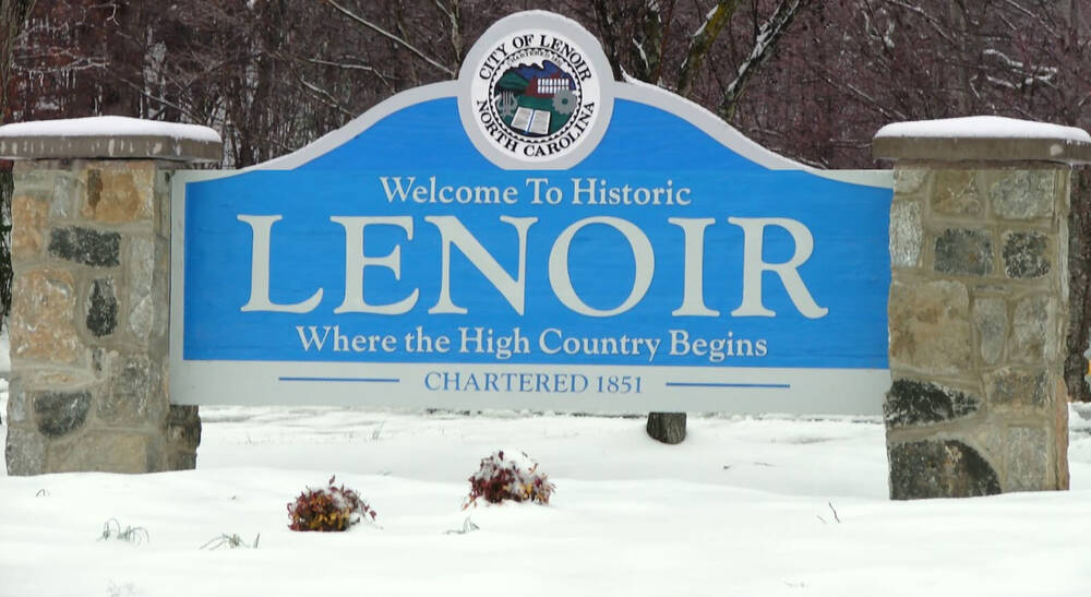 Road Sign reading Welcome to Historic Lenoir - Where the High Country Begins